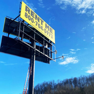 Solar billboard light installed on commercial structure